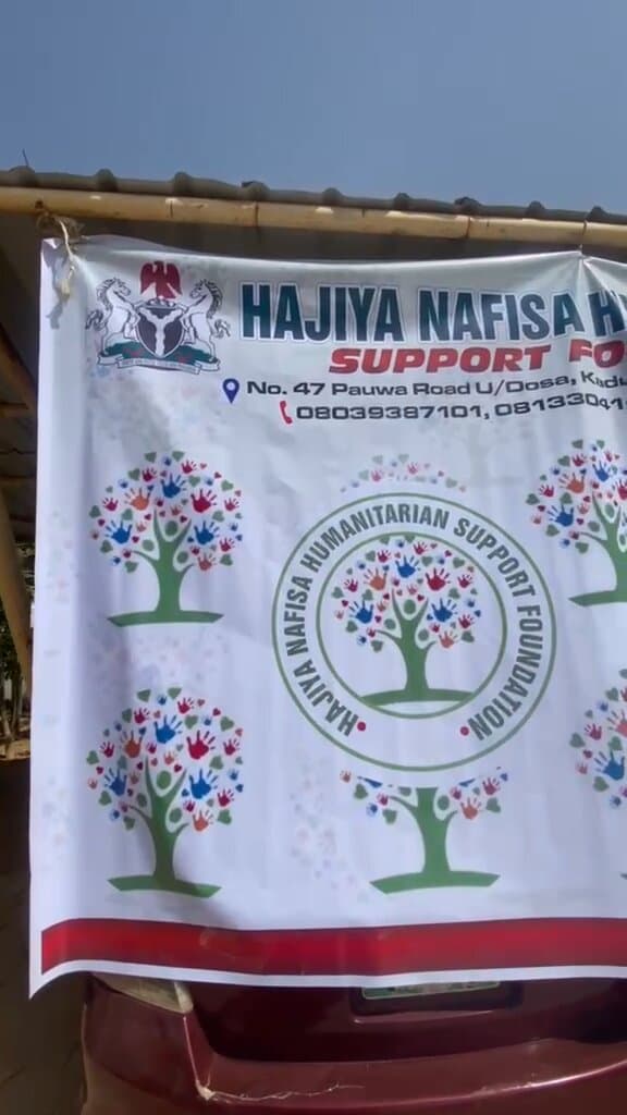 The foundation's banner at its Kaduna office, showing the registered address and phone numbers